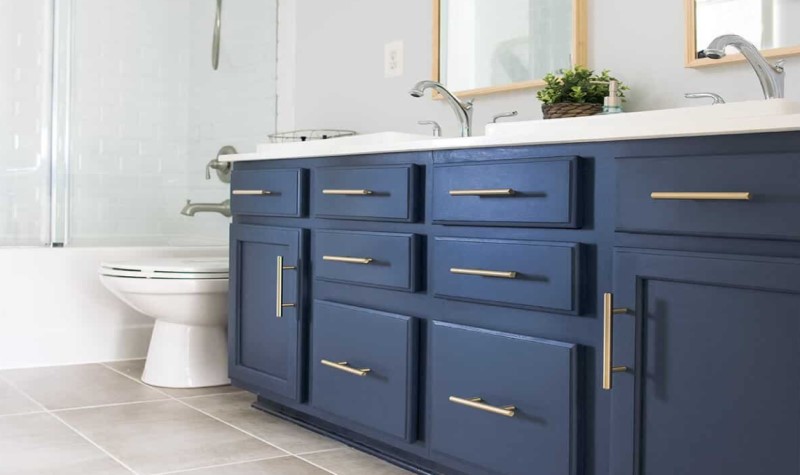 Incorporate Brass Elements & Accents - modern navy blue bathrooms